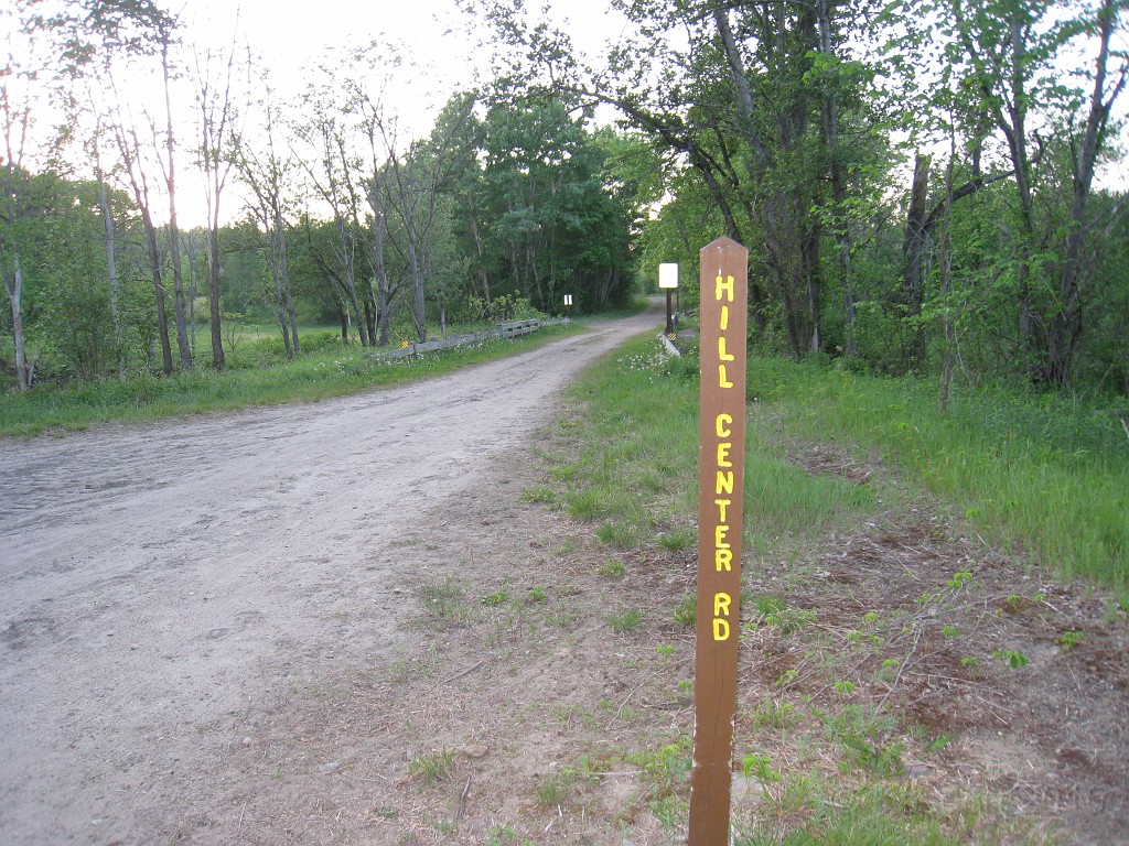 Old Hill Village - South End 425.jpg - In February 1937, residents of Hill Village NH learned that their village, near the Pemigewasset River, was to become a flood control reservoir for the Franklin Falls dam project. To accommodate the construction of the Franklin Falls Dam, the village of Hill NH was to be relocated. By January of 1940, the citizens of Hill NH formed an association, purchased land, and began planning a new model village with the help of the NH State Planning and Development Commission. Construction started in 1940, and by June of 1941 the new town hall and school were completed, along with the streets, water system, and 30 houses. The 1941 town meeting was called to order in the old town hall, recessed, and reconvened in the new village.